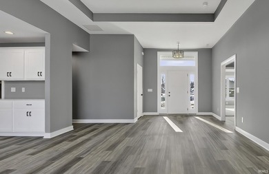 This new construction, ranch home, sits on a pond lot in the new - photo 3