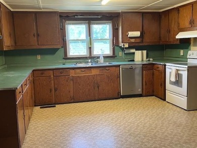 This 3 BR, home sits on a generous 5 acres with lots of space