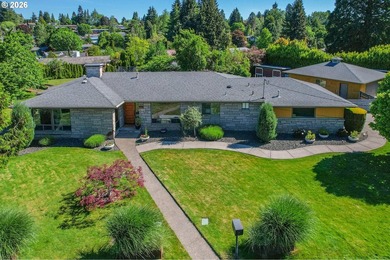 Beautifully updated classic 1959 Mid-Century ranch situated on a - photo 1