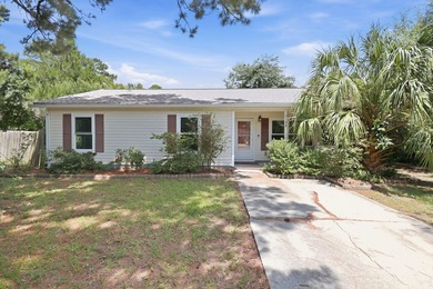 Nestled behind mature native landscaping, this home doesn't just - photo 1