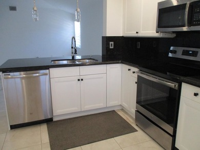 Welcome to this exceptionally remodeled second floor corner - photo 23