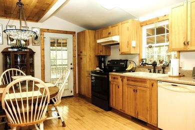 Surrounded by nature, this charming 3-bedroom, 2-bath waterfront - photo 3