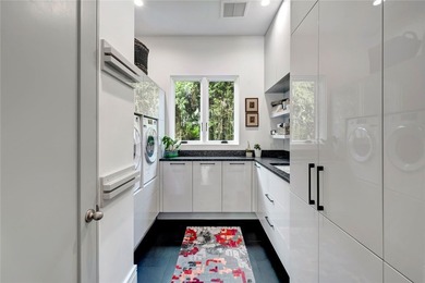 Located in Riomar Bay II, this 3 BD/4.5 BA residence blends - photo 20