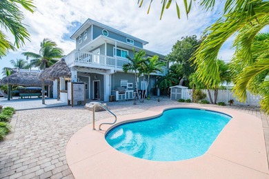 Nestled on the picturesque shores of Ramrod Key, this stunning - photo 1
