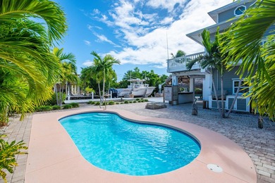 Nestled on the picturesque shores of Ramrod Key, this stunning - photo 2