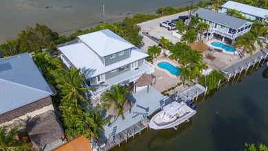 Nestled on the picturesque shores of Ramrod Key, this stunning - photo 3