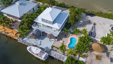 Nestled on the picturesque shores of Ramrod Key, this stunning - photo 6