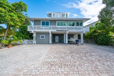 Nestled on the picturesque shores of Ramrod Key, this stunning - photo 7