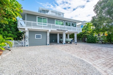 Nestled on the picturesque shores of Ramrod Key, this stunning - photo 8