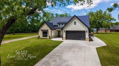 Experience luxury lake living in this stunning new construction - photo 1