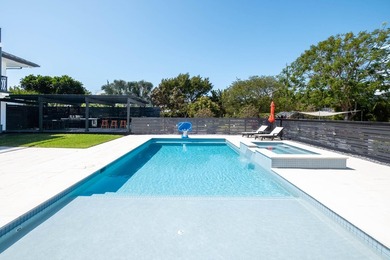 Beautifully remodeled 1998 concrete home is situated on a - photo 6
