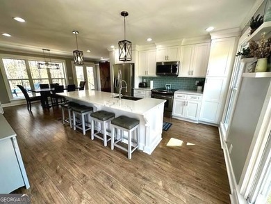LAKE FRONT, HUGE 8 CAR GARAGE, POOL, DEEP WATER DOCK WITH LIFT - photo 3