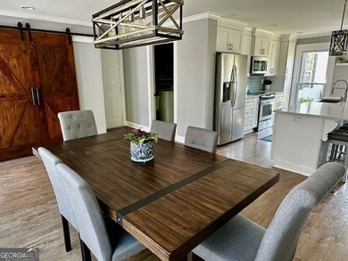 LAKE FRONT, HUGE 8 CAR GARAGE, POOL, DEEP WATER DOCK WITH LIFT - photo 6