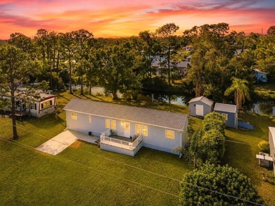 Own the land, skip the lot rent, and enjoy turnkey canal-front - photo 2