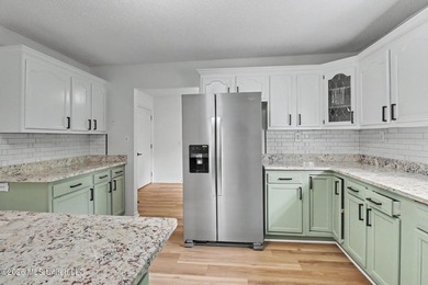 Recently renovated and move-in ready, this spacious 4-bedroom, 2 - photo 11