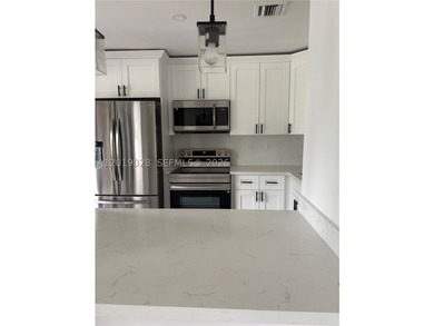 Welcome to this beautifully renovated three-story corner - photo 8