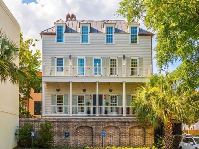 Experience the pinnacle of downtown Charleston living in this - photo 1