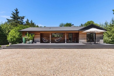 Discover a private Hamptons sanctuary where modern luxury meets - photo 6