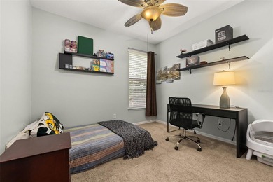 Located in Celebration, this 3-bedroom, 2.5-bathroom home backs - photo 35