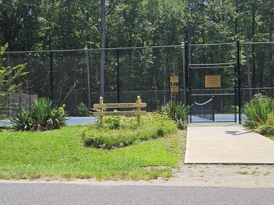 Level, wooded lot just under an acre, nestled in the golf cart - photo 5