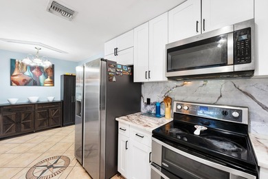 Welcome to this well-maintained 4-bedroom, 2-bathroom home - photo 13