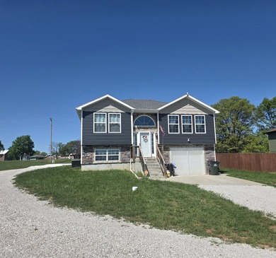 Check out this home nestled in the heart of Stockton, Missouri! - photo 1