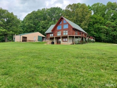 Situated on a picturesque hill on over 9 acres near Patoka Lake - photo 4