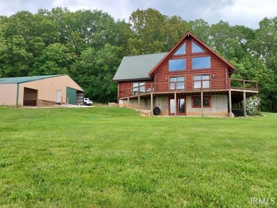 Situated on a picturesque hill on over 9 acres near Patoka Lake - photo 5