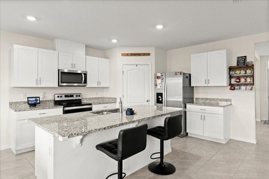 This 5-bedroom, 3-bath home sits on a spacious lakefront lot in - photo 7