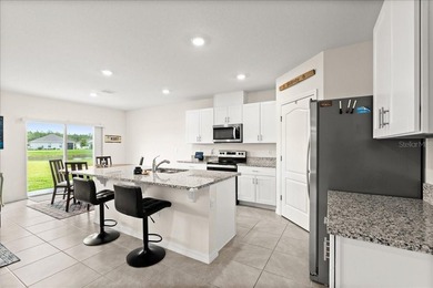 This 5-bedroom, 3-bath home sits on a spacious lakefront lot in - photo 9