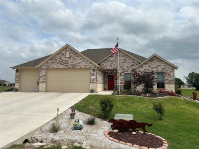 This custom home features an enclosed porch with a mini split - Lake Home For Sale in Runaway Bay, Texas