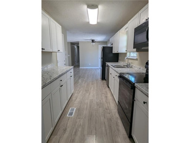 Fully renovated ranch with a daylight basement. Arrive at a