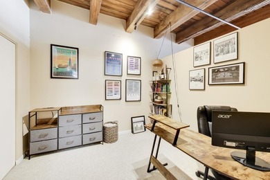 Step into this stunning brick-and-timber loft at the Premiere