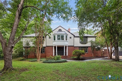 Hidden among mature trees on a rare double lot, this exceptional - photo 1
