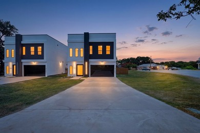 Experience modern waterfront luxury in this stunning - photo 1