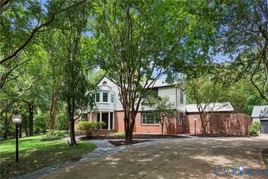 Hidden among mature trees on a rare double lot, this exceptional - photo 2