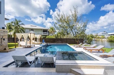 This Key Largo Lake front estate delivers a level of design and - photo 5