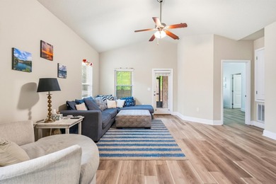 Newer LVP flooring flows through this open-concept Hammock Bay - photo 12
