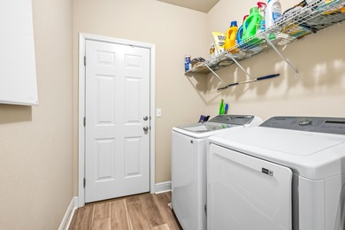 Newer LVP flooring flows through this open-concept Hammock Bay - photo 28