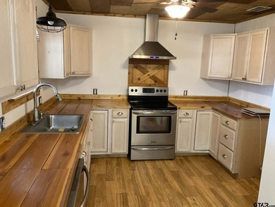 Charming 3 bedroom, 2 bath home situated on approximately .41