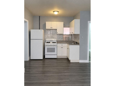 Fully renovated detached brick 3 family in the Wakefield section - photo 2