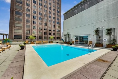 Located on a high floor right on the Magnificent Mile, this - photo 12