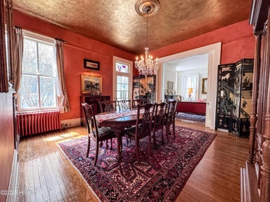 This meticulously maintained Italianate home is presented for