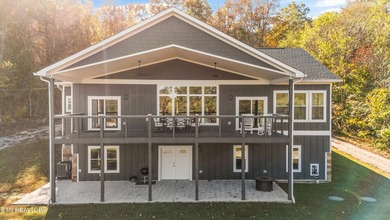 Situated on 1.48 acres of wooded land with stunning lake views - photo 2