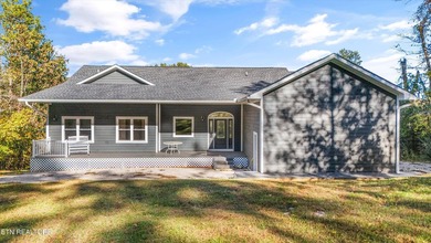 Situated on 1.48 acres of wooded land with stunning lake views - photo 4
