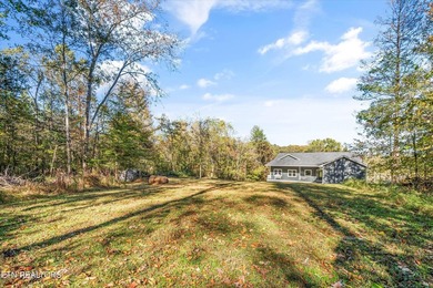 Situated on 1.48 acres of wooded land with stunning lake views - photo 5