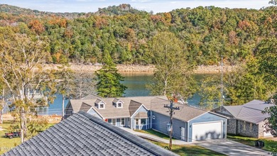 Situated on 1.48 acres of wooded land with stunning lake views - photo 7