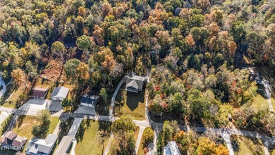 Situated on 1.48 acres of wooded land with stunning lake views - photo 8