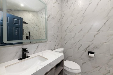 Welcome to this fully renovated 3-bedroom, 2.5-bathroom home - photo 12