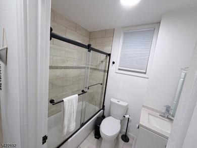 Welcome to this exceptional, fully renovated two-family - photo 9